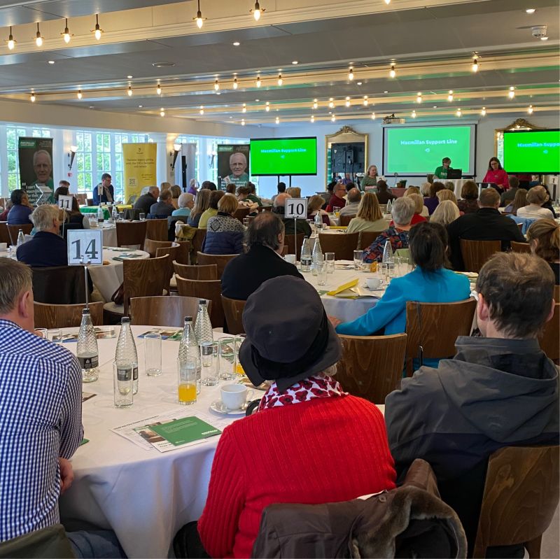 Guests seated at a Macmillan Gifts in Wills event